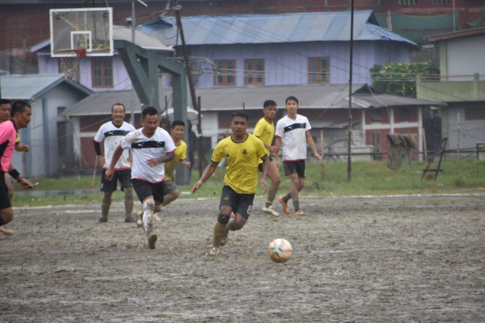 Super Seniors (white and black jerseys) battling it out against MMSC (yellow and black jerseys) on the muddy pitch during the 3rd quarterfinal match of the ongoing MDFA Trophy 2024 at Imkongmeren Sports Complex on October 24.